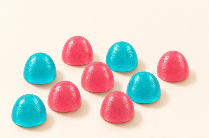 Gomitas de creatina Fills auténticas sobre fondo crema